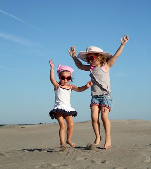 two little girl fun and jumping