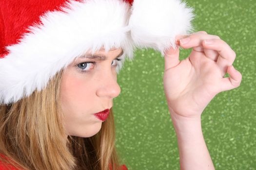 Teenager with red lips wearing a christmas hat