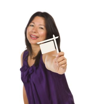 Attractive Multiethnic Woman Holding Blank Small Real Estate Sign in Hand Isolated on White Background Ready for Your Own Message.
