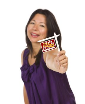 Attractive Multiethnic Woman Holding Small Sold For Sale By Owner Real Estate Sign in Hand Isolated on White Background.