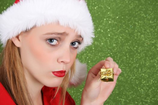Teenager with red lips wearing a christmas hat