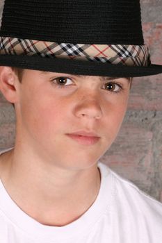 Teenage boy wearing a black hat in casual wear