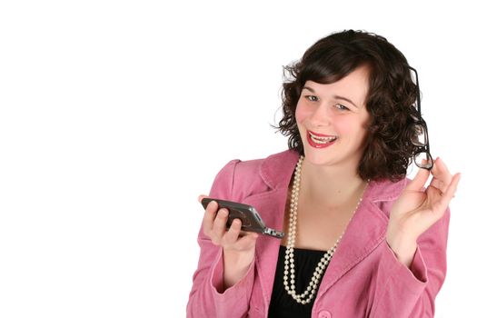 Friendly business woman holding her phone and spectacles