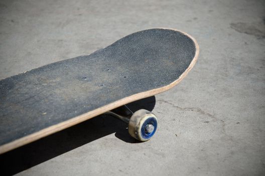 Skateboard front, selective focus on nose grip texture.