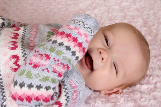 Cute two month old smiling baby girl 