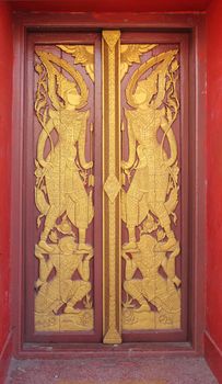 Buddhist temple door decoration in the capital of Vientiane, Laos