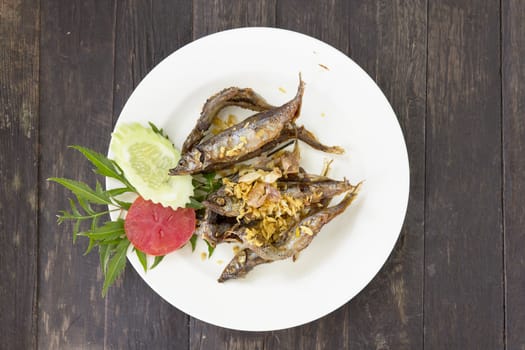 Deep fried shisamo fish on plate at Thai restaurant