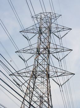 Electrical tower against blue sky