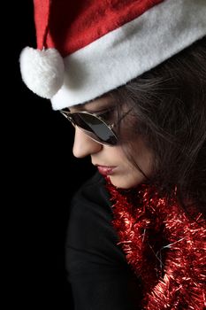 Brunette Christmas female on black with sunglasses