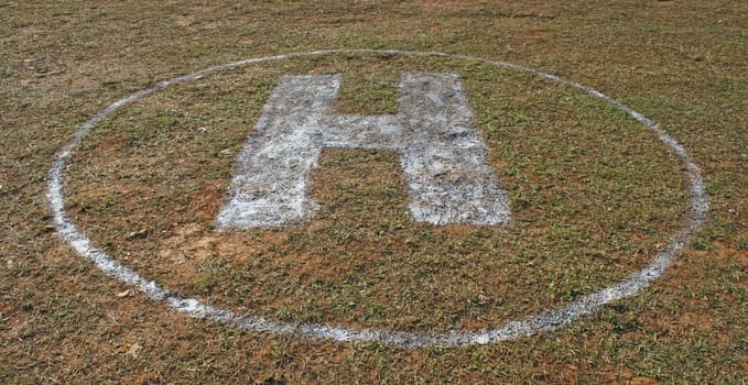 Helicopter landing spot on the grass field