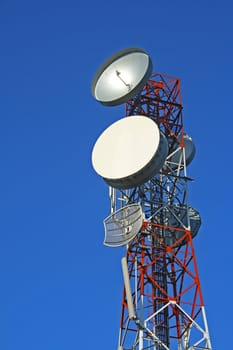 Communication tower over a blue sky