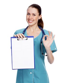 Smiling female doctor holding a clipboard against white background.