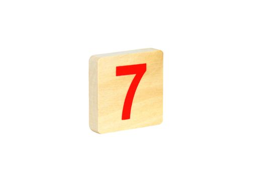 Figure seven on a wooden square on a white background