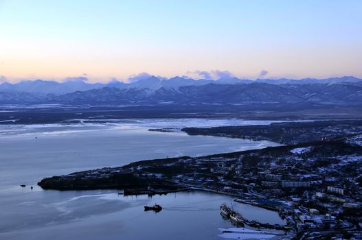 Mooring on kamchatka  with volcanoes in city boundaries