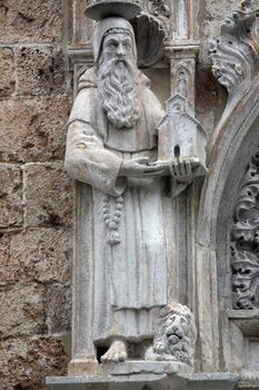 Statue of St. Jerome on the portal of the Franciscan church of the Friars Minor in Dubrovnik