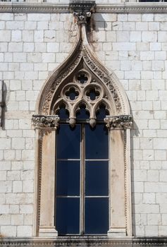 Beautiful window of Sponza Palace in Gothic-Renaissance style in Dubrovnik