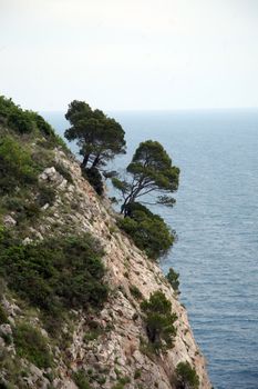 Pictorial blue Adriatic sea with rocks