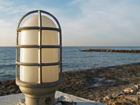 Closeup lamp on seashore background