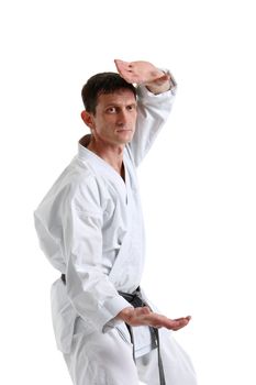 Karate. Man in a kimono with a white background
