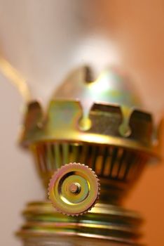 lit golden kerosene lamp details closeup macro