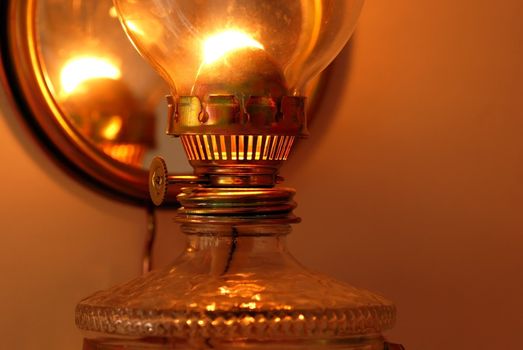 lit golden kerosine lamp details closeup macro