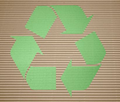 green recycling on corrugated cardboard with background