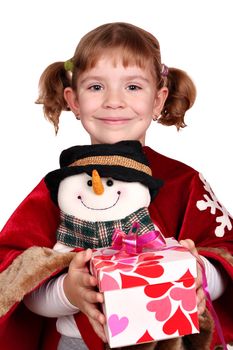 little girl holding a Christmas present