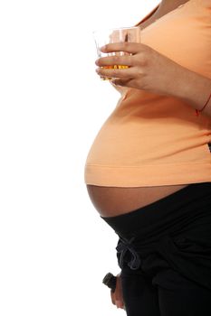 Pregnant woman holding glass of alcohol ( whisky ), isolated on white