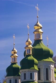 Golden dome of the Orthodox church with blue sky background, Russia. 
