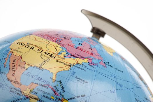 Close up of a globe against a white background
