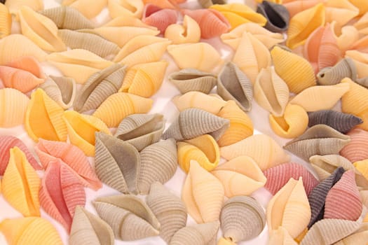 a handful of colored pasta as a background image