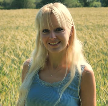 Blond woman in field