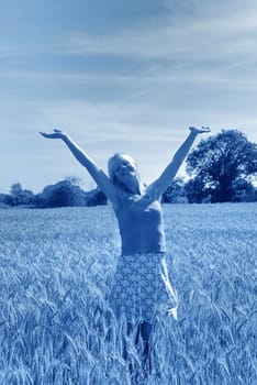 Blond woman in field