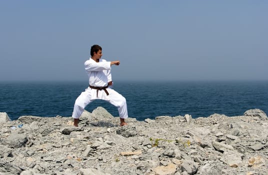 karate trains on the shores of the misty sea