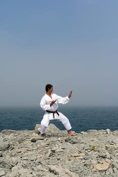 karate trains on the shores of the misty sea