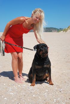 woman at beach with dog