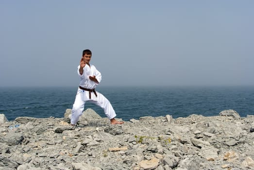 karate trains on the shores of the misty sea