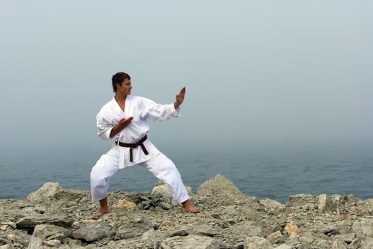 karate trains on the shores of the misty sea