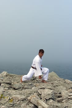 karate trains on the shores of the misty sea