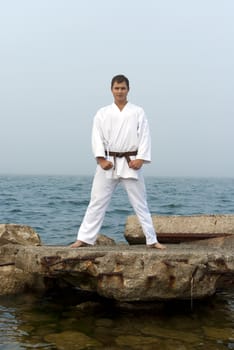 karate trains on the shores of the misty sea