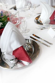 Formal, elegant table decoration in red with text space