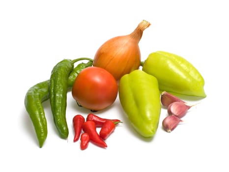 Still-life with fresh vegetables on a white background.