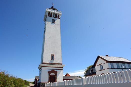 Lighthouse in Helnaes Denmark year built 1900 in wide angle view