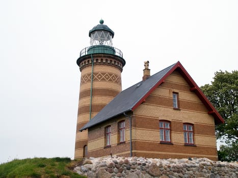 Classic lighthouse by the sea ocean Denmark
