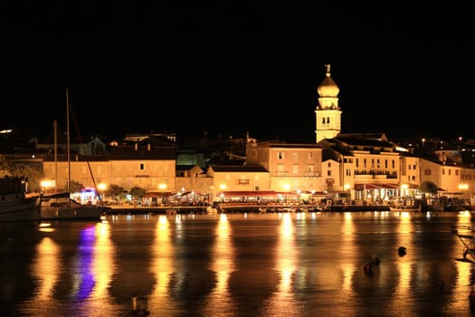 Evening in the Town of Krk, Croatia, reflections of waterfront