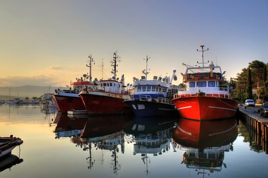 Fishing boats in harbor on early morning, calm sea, Island of Krk, Croatia