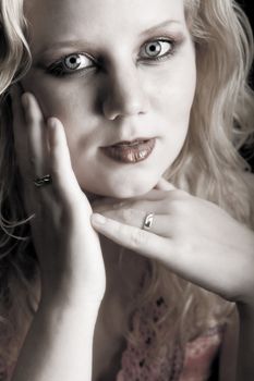 Studio portrait of a blond young lady feeling beautiful