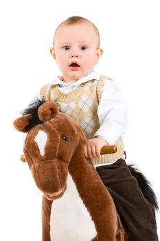 boy of one year riding a toy-horse