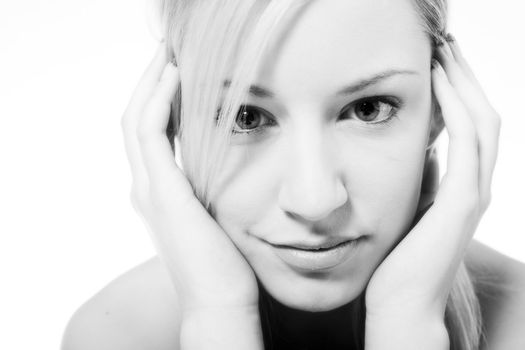 Studio portrait of a young blond woman flirting