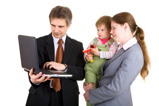 father and mother dressed for business with child look into the notebook